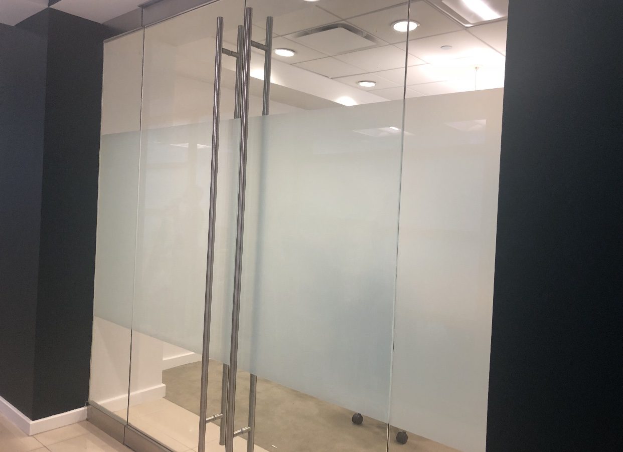 Commercial window film installation on office glass in BC