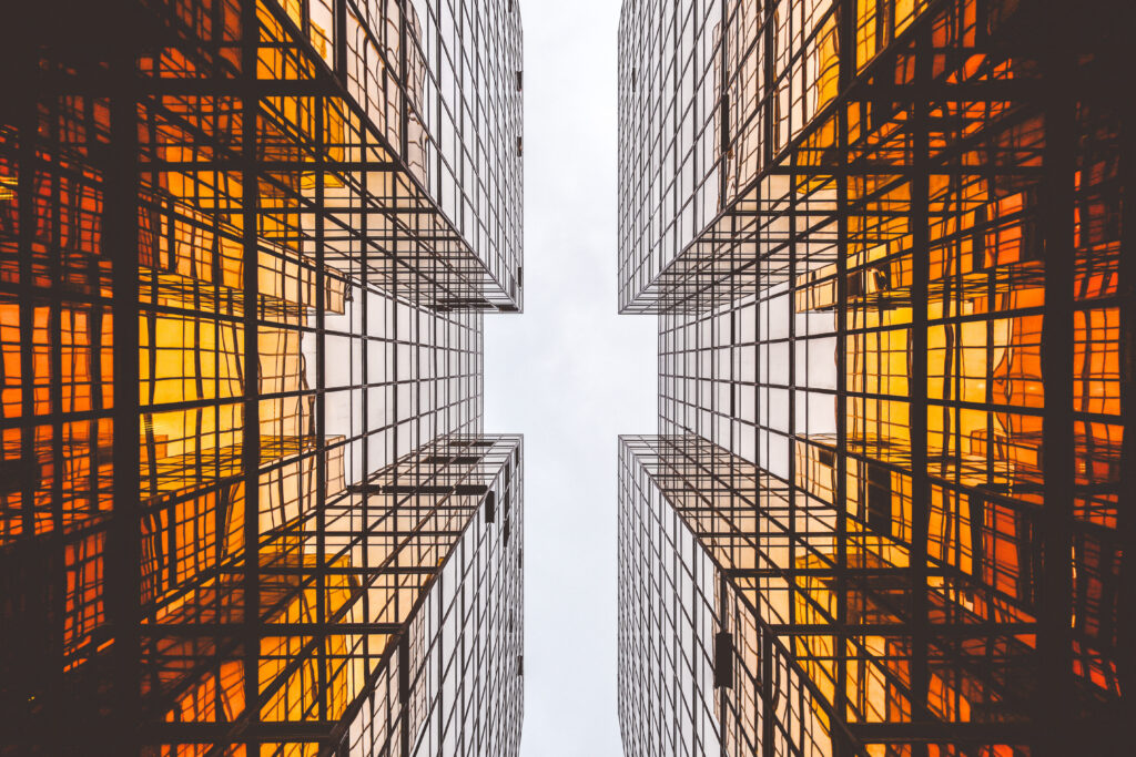 Reflective glass facade of a modern building — illustrating the one-way mirror effect of solar privacy window film