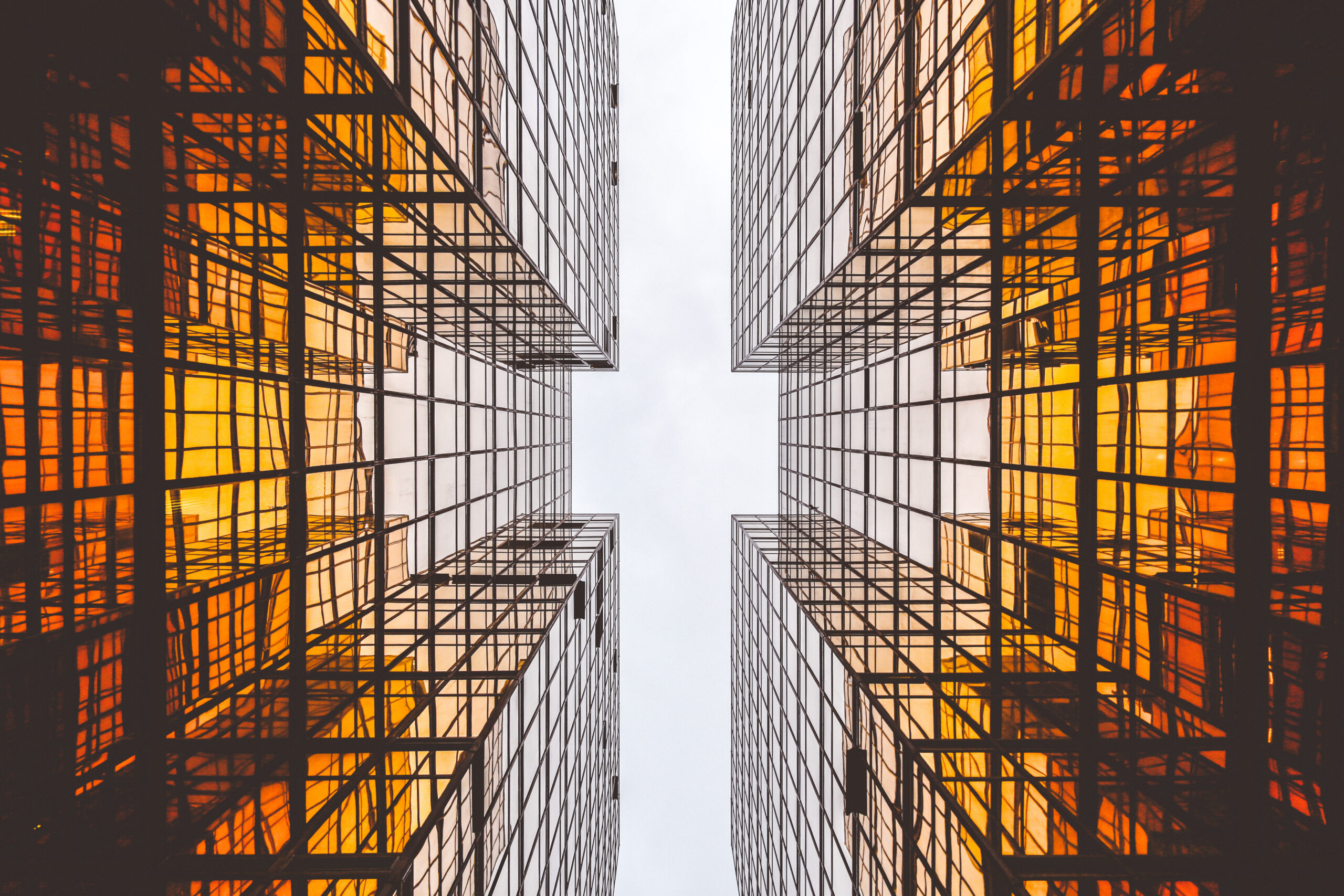 Reflective glass facade of a modern building — illustrating the one-way mirror effect of solar privacy window film