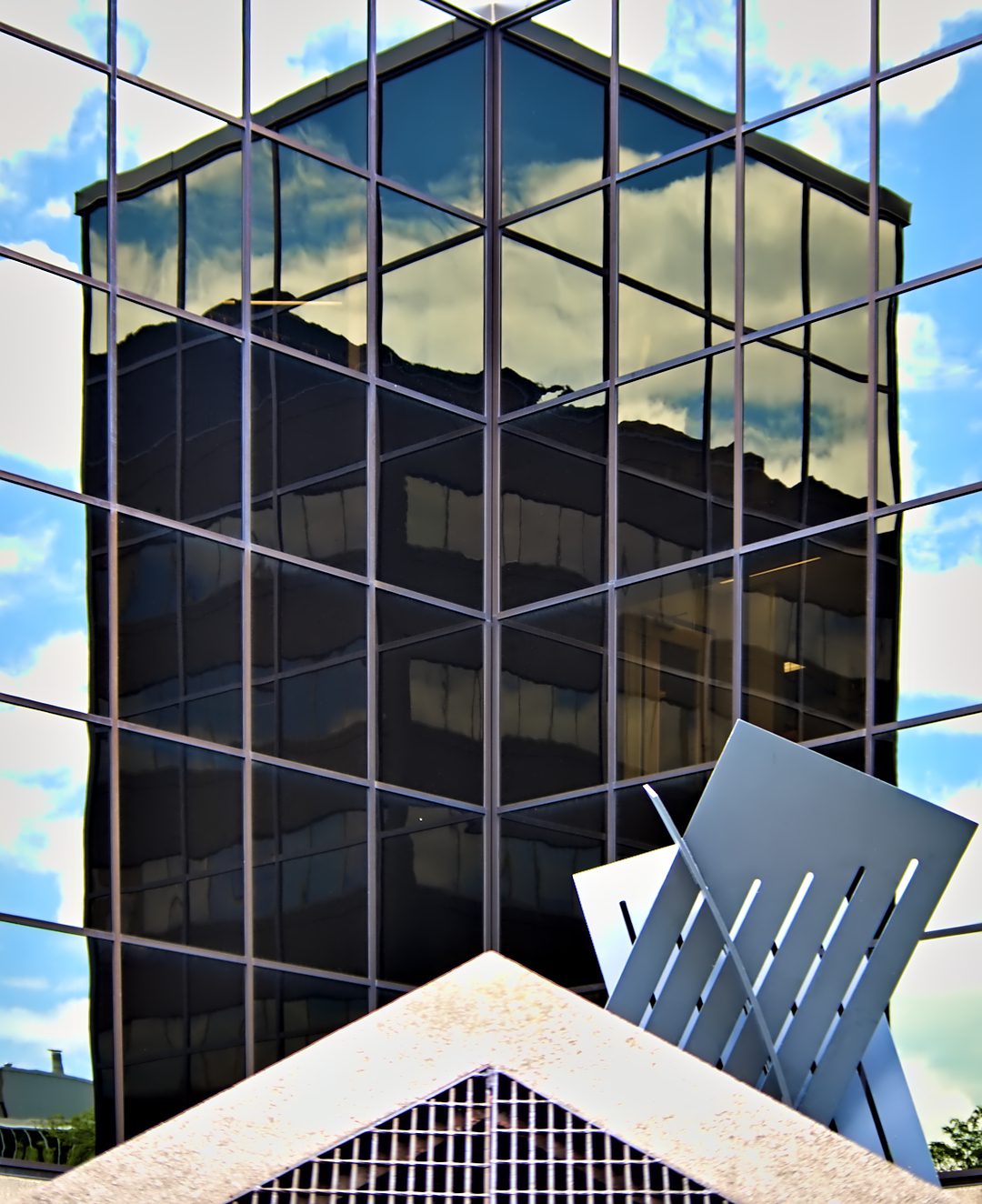 Geometric reflective glass window pattern on a Canadian building — illustrating the patterned glazing principle behind bird safe window film in BC