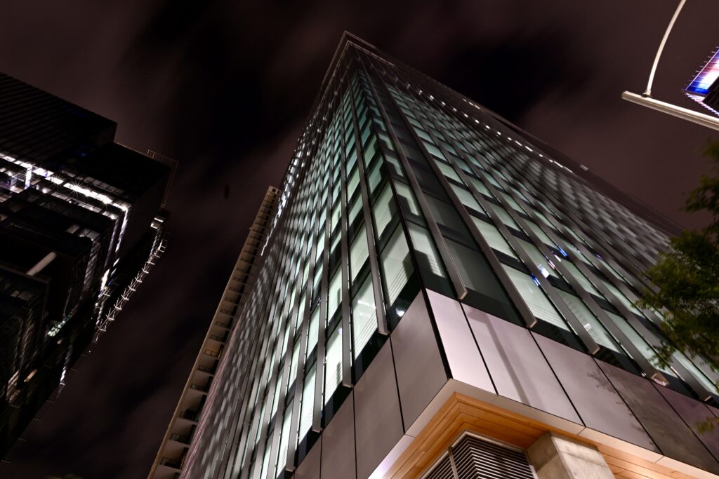 Translucent frosted glass panels on a commercial building — illustrating the role of safety and shatter resistant window film in BC properties