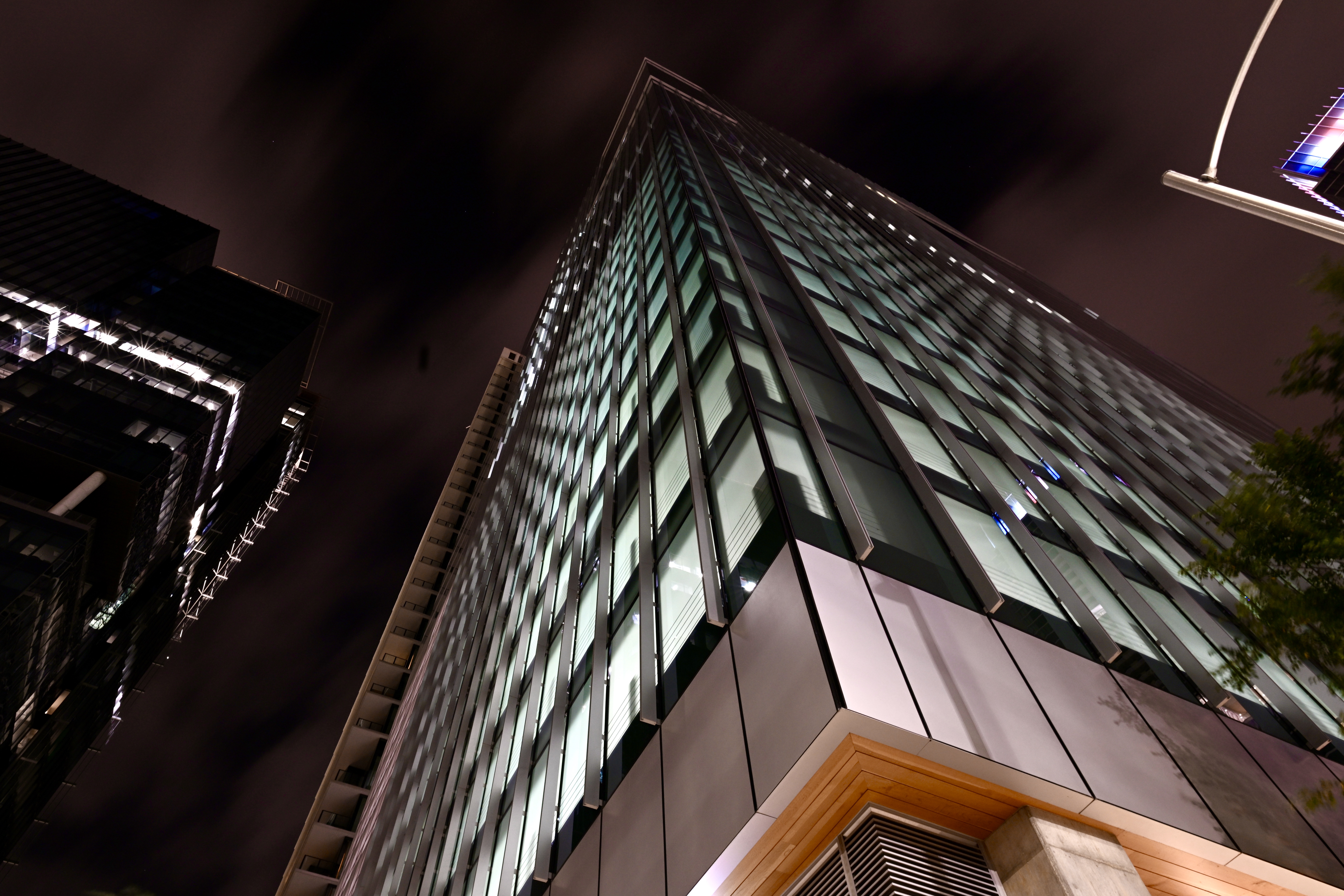 Translucent frosted glass panels on a commercial building — illustrating the role of safety and shatter resistant window film in BC properties