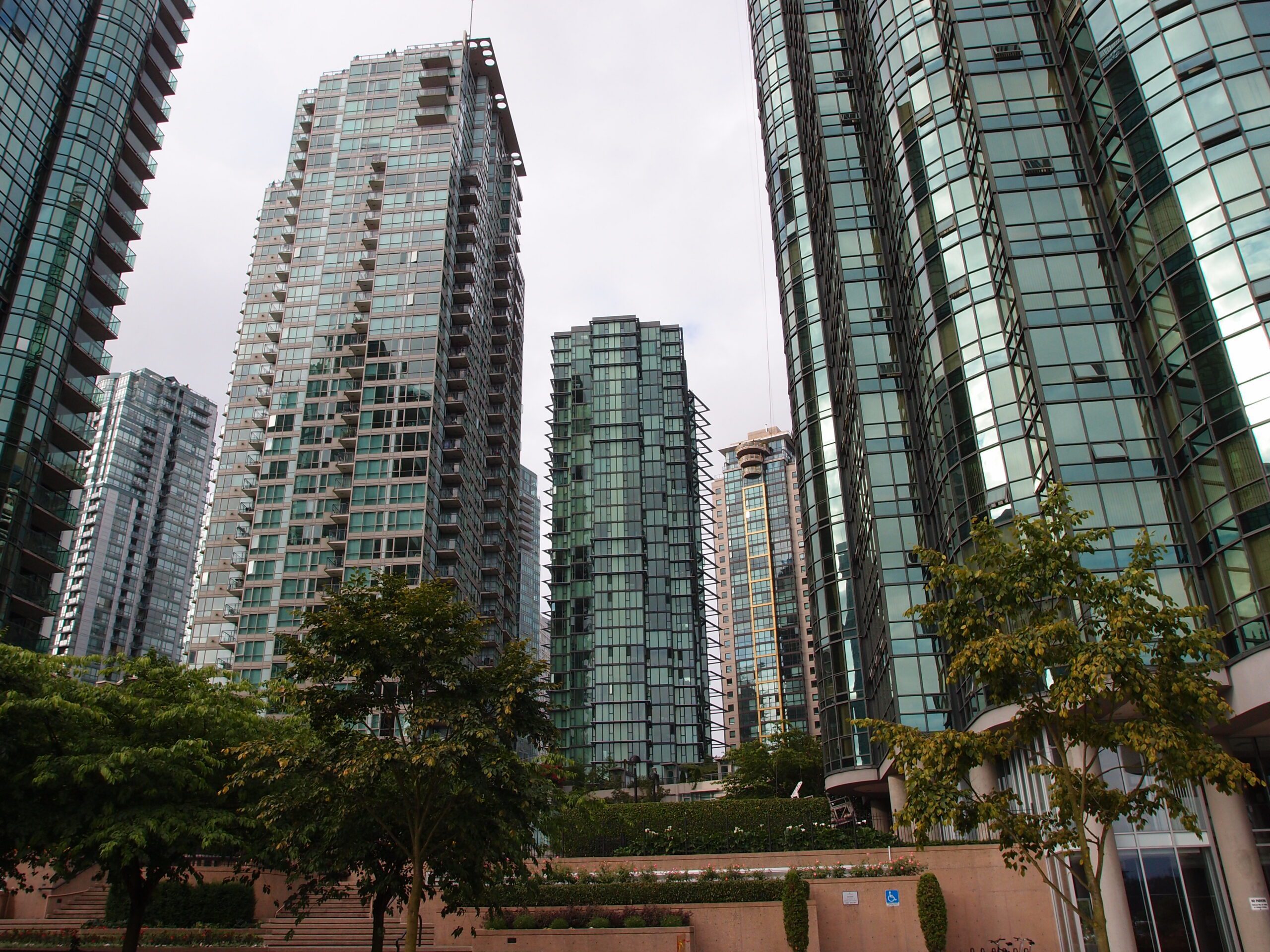 Downtown Vancouver high-rise buildings with glass curtain walls — window film installation for high-rise towers in Vancouver BC