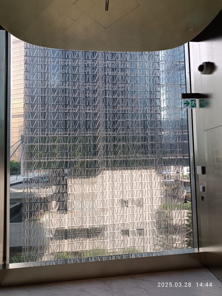 Commercial glass wall interior with floor-to-ceiling glazing — the type of window wall system Ecovision installs window film on across Vancouver