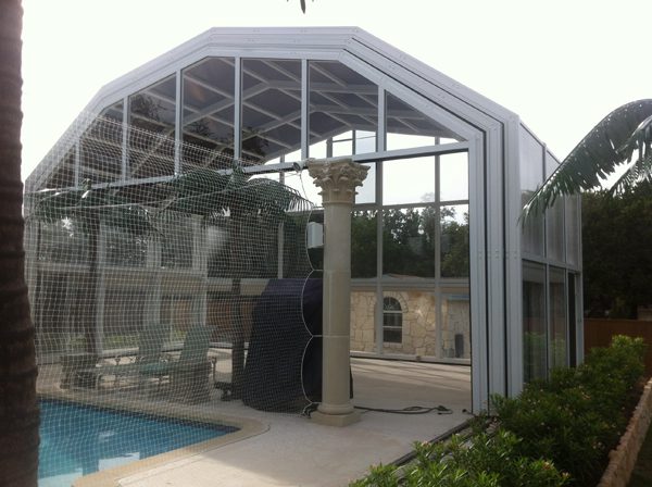 Glass sunroom and spa pool enclosure showing the type of glazed space that benefits from solar control window film in BC