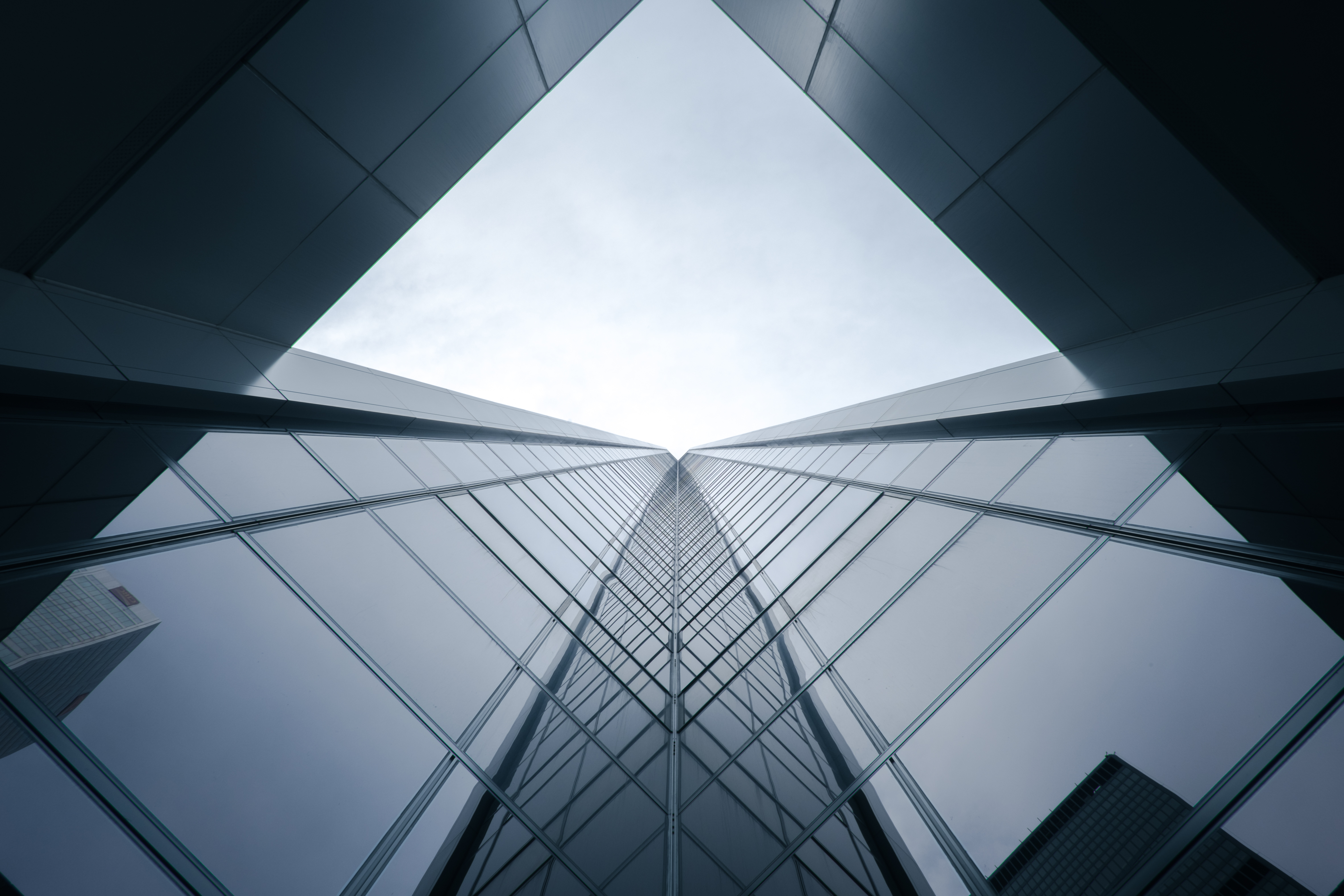 Modern glass building facade representing professional architectural window film warranty coverage in BC