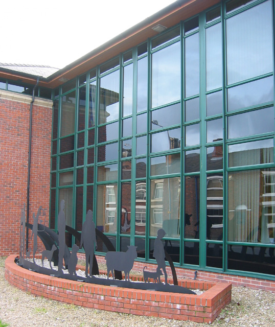 Veterinary hospital exterior with large glazed windows, representative of clinic glass that can take architectural window film