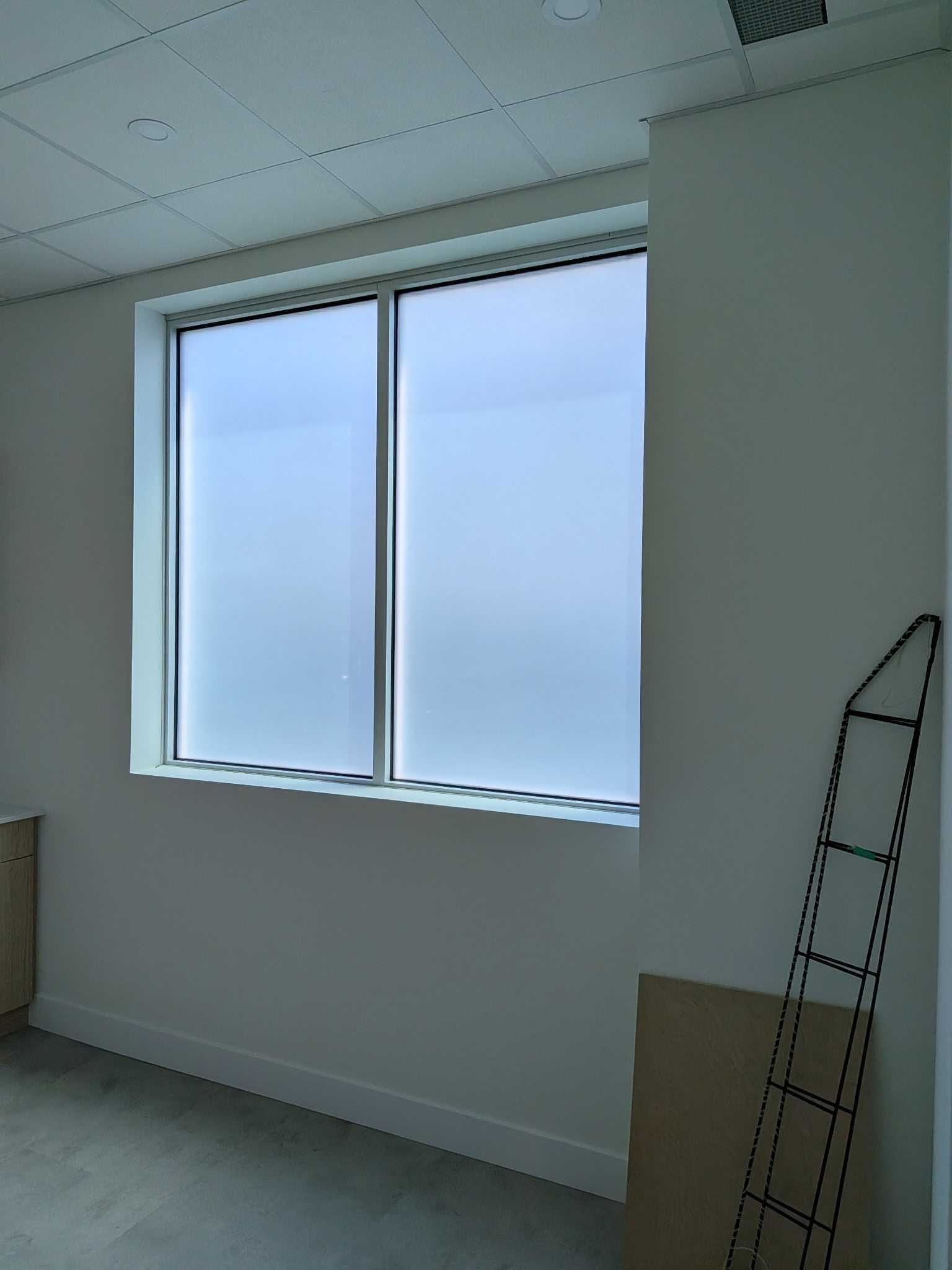 Frosted privacy film on a commercial interior window