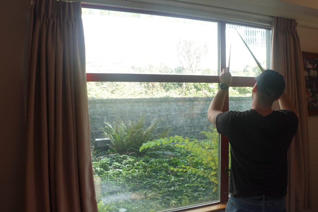 Ecovision installer applying window film at St. Michaels Extended Care in Burnaby