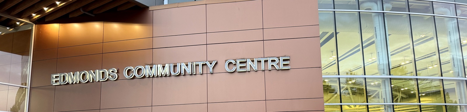 Site-visit photograph showing the Edmonds Community Centre name on its entrance facade.